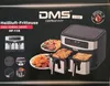 A product box for a DMS air fryer, showing the product and food. Produktbild-Vorschau
