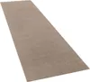 A long, taupe-colored rug is shown from a diagonal, slightly elevated perspective against a white background. Produktbild-Vorschau