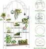 A multi-tiered plant stand with various potted plants displayed on its shelves and hanging from its arch. Anteprima dell’immagine prodotto