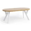 A wooden oval dining table with white X-shaped legs, shown from a side-angle on a white background. Voir les images du produit
