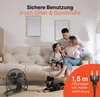 A family and their dog are relaxing in a living room with a fan. Náhľad obrázku produktu