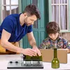A man and a child are working on a project with a bottle cutter. Produktbild-Vorschau