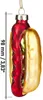 A glass ornament shaped like a hot dog, with a ruler indicating its size. Produktbild-Vorschau