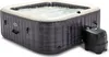 An inflatable hot tub filled with water and a control unit next to it, set against a white background. Voir les images du produit
