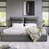 A modern bedroom with a large bed, nightstands, and windows. Podgląd zdjęcia produktu