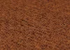 A close-up, textured view of terracotta-colored fabric. Náhľad obrázku produktu
