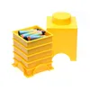 A yellow LEGO storage brick and a stack of yellow storage trays filled with colorful markers. Produktbild-Vorschau