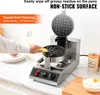 A person's hand is cleaning a waffle maker with a yellow sponge. The waffle maker is on a kitchen counter. Anteprima dell’immagine prodotto