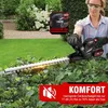 A woman is using a hedge trimmer in a garden. Produktbild-Vorschau