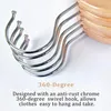 Close-up view of metal hooks attached to wooden hangers. Produktbild-Vorschau