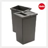 Two dark gray trash bins are shown against a white background. The bin in the foreground has a lid with two compartments. The bin in the background is open and appears to be slightly behind and to the left of the foreground bin. A red circular logo with th Produktbild-Vorschau