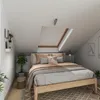 A bedroom with a bed, skylight, and plants. Produktbild-Vorschau