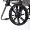 A close-up of a black wheel with a grey fabric background. Produktbild-Vorschau