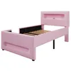 A pink twin bed frame with a headboard shelf, shown from a side angle against a white background. Náhľad obrázku produktu