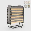 A folded bed with a mattress on a light gray background. Produktbild-Vorschau