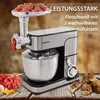 A kitchen appliance with a meat grinder attachment is shown on a wooden surface, with raw meat and cooked patties nearby. Text overlays highlight its features. Produktbild-Vorschau