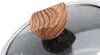 A close-up shot of a wooden handle on a pot lid. Produktbild-Vorschau