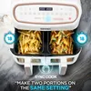 A close-up shot of a dual-chamber air fryer with food inside, highlighting its features. Produktbild-Vorschau