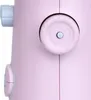 A close-up of a pink sewing machine, focusing on the control dial and a side button. Produktbild-Vorschau