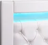 A close-up view of a white upholstered headboard with tufted buttons and integrated blue LED lighting. Produktbild-Vorschau