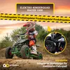A child is riding a green quad bike on a dirt track with trees and a sunset in the background. Produktbild-Vorschau
