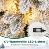 A close-up of a flocked Christmas tree with warm white LED lights, with a small inset image of a power adapter and text describing the product's features. Podgląd zdjęcia produktu