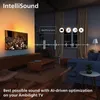 A living room scene with a TV displaying an orchestra, showcasing the IntelliSound feature with audio waveform visualization and scene identification icons. Voir les images du produit
