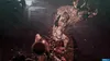 A monstrous, furry creature with antlers and chains is depicted in a dark, industrial setting. Produktbild-Vorschau