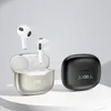 Two pairs of wireless earbuds and their charging cases are displayed against a light gray and white background. Náhled obrázku produktu