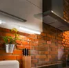 A close-up view of a kitchen under-cabinet light fixture. Produktbild-Vorschau