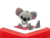 A toy koala figure sitting on a red cube with a white top surface. Produktbild-Vorschau