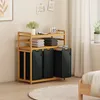 A laundry organizer with multiple compartments and shelves in a bedroom setting. Anteprima dell’immagine prodotto