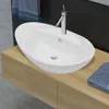 A white ceramic oval basin with a chrome faucet sits on a light wood vanity. Podgląd zdjęcia produktu