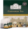 A box of Ahmad Tea Cardamom tea with several tea bags in the foreground, set against a backdrop of a castle and garden scene. Podgląd zdjęcia produktu