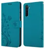 A teal flip phone case with a floral and butterfly design is shown. Náhled obrázku produktu