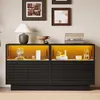 A black sideboard with illuminated glass display shelves featuring decorative items and a turntable. Produktbild-Vorschau
