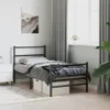 A bedroom scene with a single bed, nightstand, and artwork on the wall. Náhled obrázku produktu