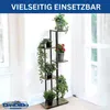 A multi-tiered plant stand with several potted plants displayed indoors near a window. Produktbild-Vorschau