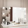 A vanity table with a mirror and makeup accessories. Produktbild-Vorschau
