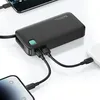 A black power bank is shown charging multiple devices, including two smartphones and a white device, likely earbuds. Náhled obrázku produktu