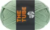 A ball of green yarn with a black label. Produktbild-Vorschau