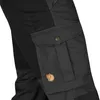 Close-up of a cargo pocket on black outdoor trousers. Produktbild-Vorschau