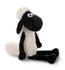 A plush toy sheep sitting on a white background. Produktbild-Vorschau