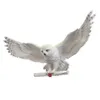 A decorative snowy owl figurine with outstretched wings holding a scroll. Produktbild-Vorschau
