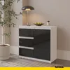 A modern sideboard with drawers and a door, placed in a room with a plant and a lamp. Náhled obrázku produktu