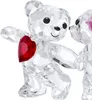 Two crystal teddy bears, one holding a red heart, against a white background. Produktbild-Vorschau