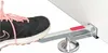 A close-up shot of a shoe stepping on a door and panel lifter. Náhľad obrázku produktu