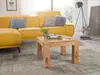 A living room scene with a yellow sectional sofa, a wooden coffee table with a model car, and a floor lamp. Anteprima dell’immagine prodotto