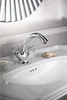 A close-up shot of a chrome faucet on a white sink, with a small bar of soap and a jar of cream on the sink. Anteprima dell’immagine prodotto