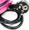 A close-up of a pink waffle maker's power cord and plug. Náhled obrázku produktu